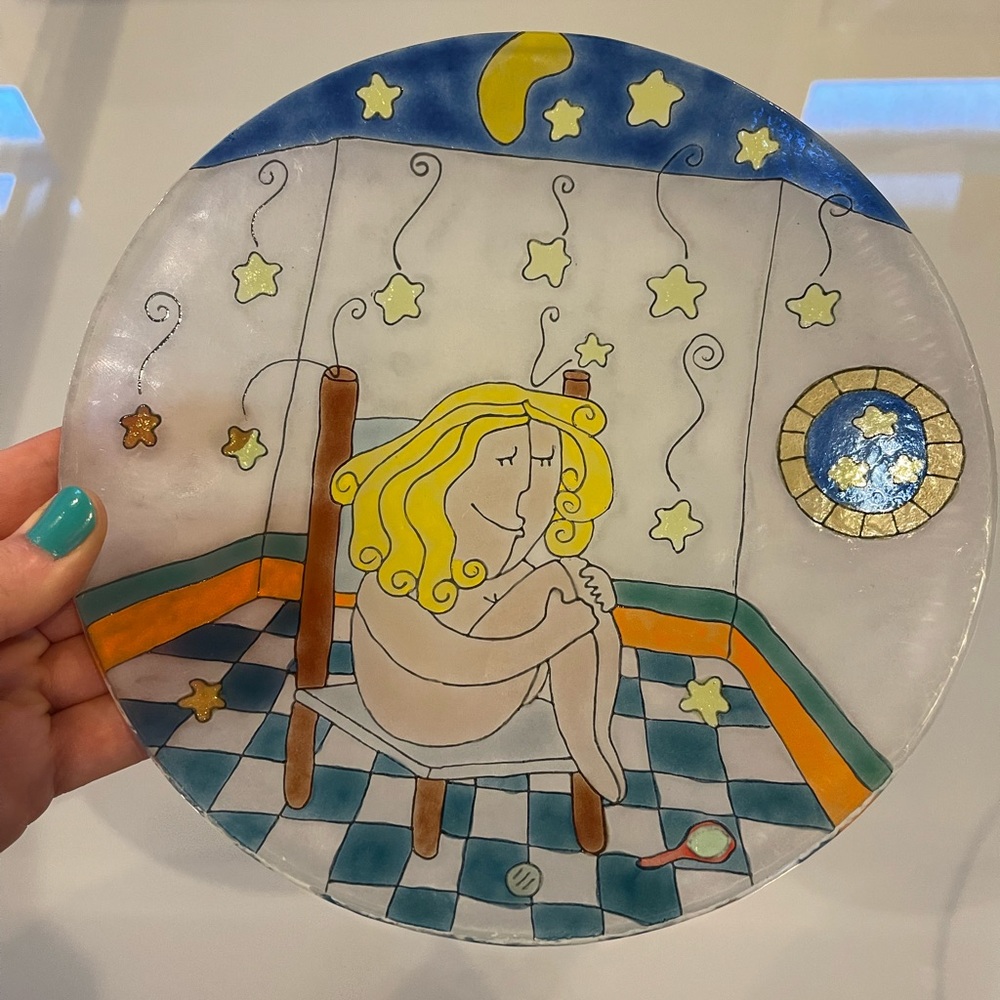 Colorful art design glass Plate with a necked lady sitting on the chair